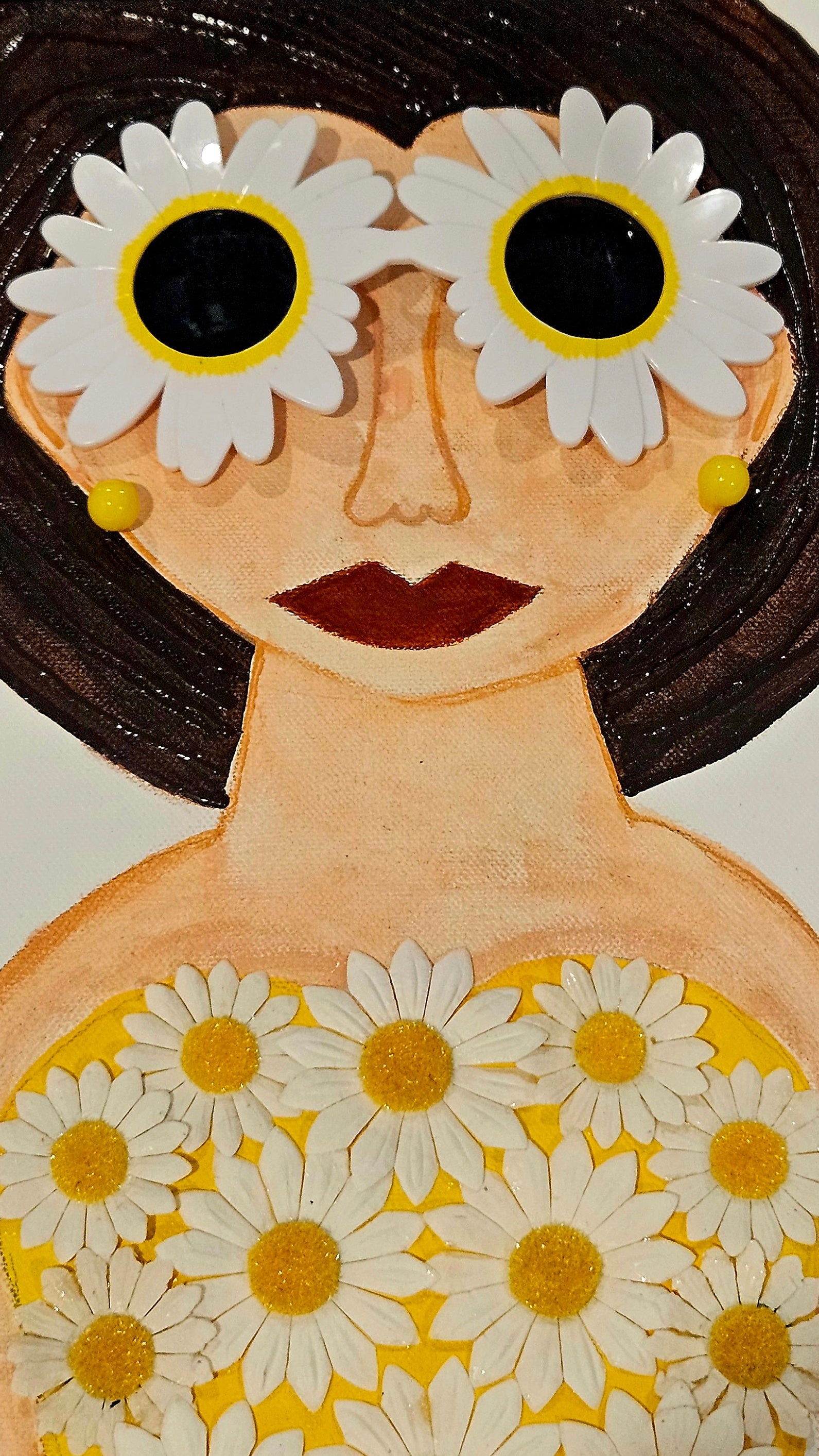 Wooden figurine with floral patterns on a plain background