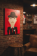 Illustration of a person wearing a black hat and suit with a red tie on a red background