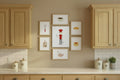 Kitchen with wooden cabinets and framed artwork on the wall.