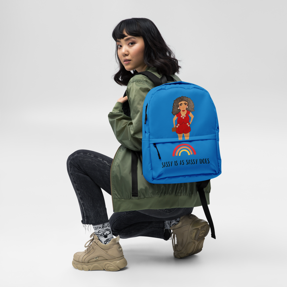 womam wearing a blue backpack with a character of a cartoon woman