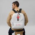 Man wearing a white backpack with 'Valuble' branding on a gray background