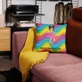 Red sofa with a patterned pillow and blanket in a living room setting.