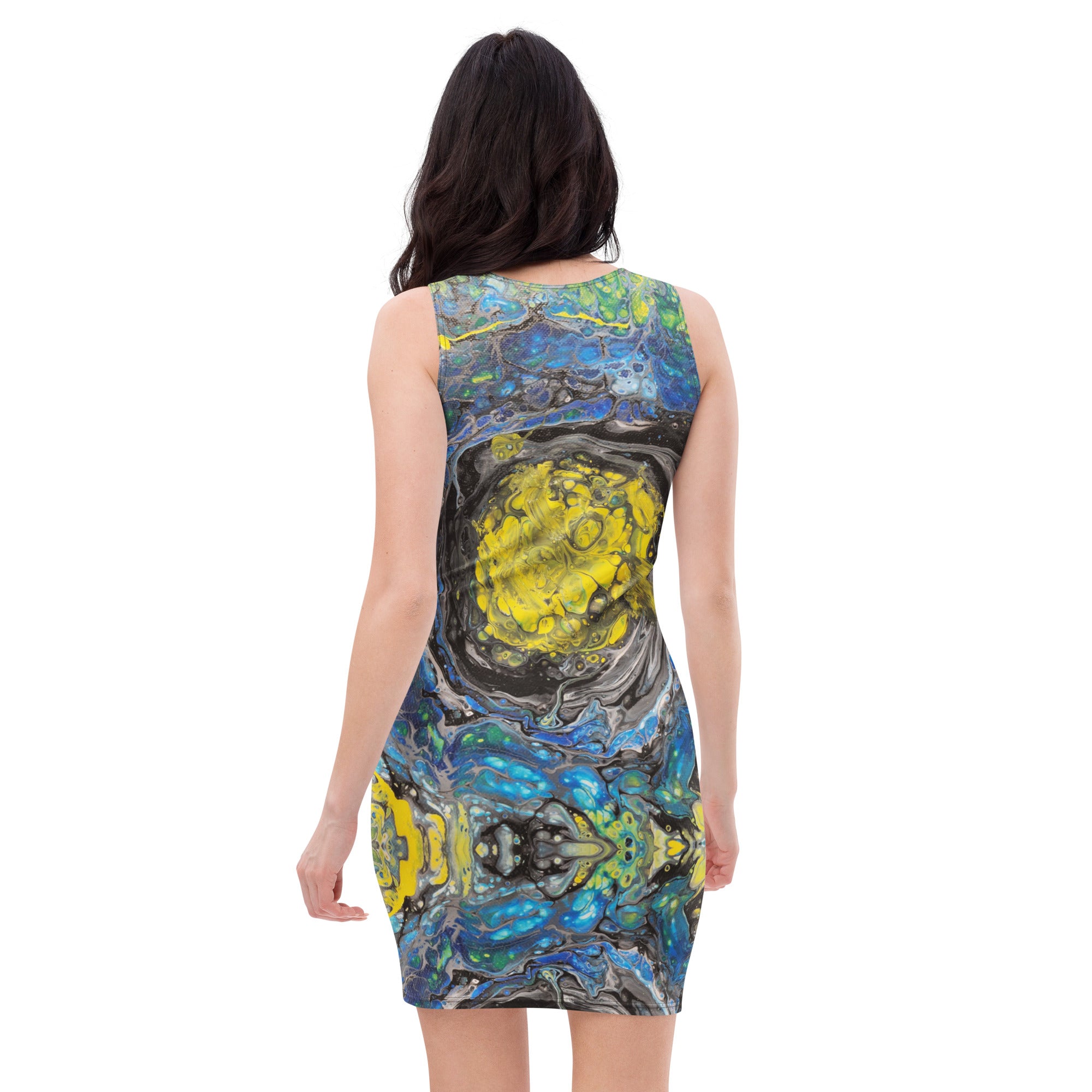 Woman wearing a sleeveless dress with abstract yellow and blue pattern on a white background