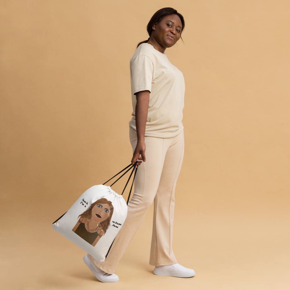Woman holding a tote bag with a graphic design on a beige background