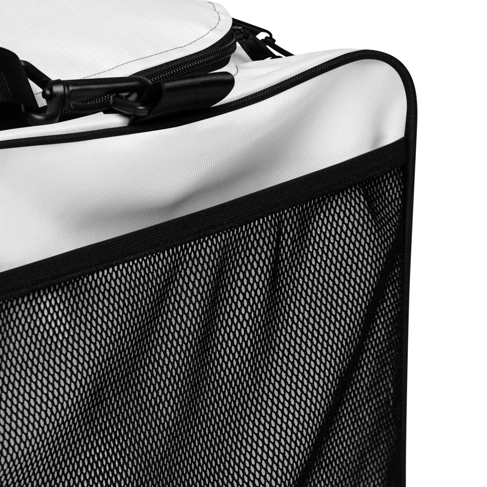 Close-up of a pet carrier with mesh side and white interior
