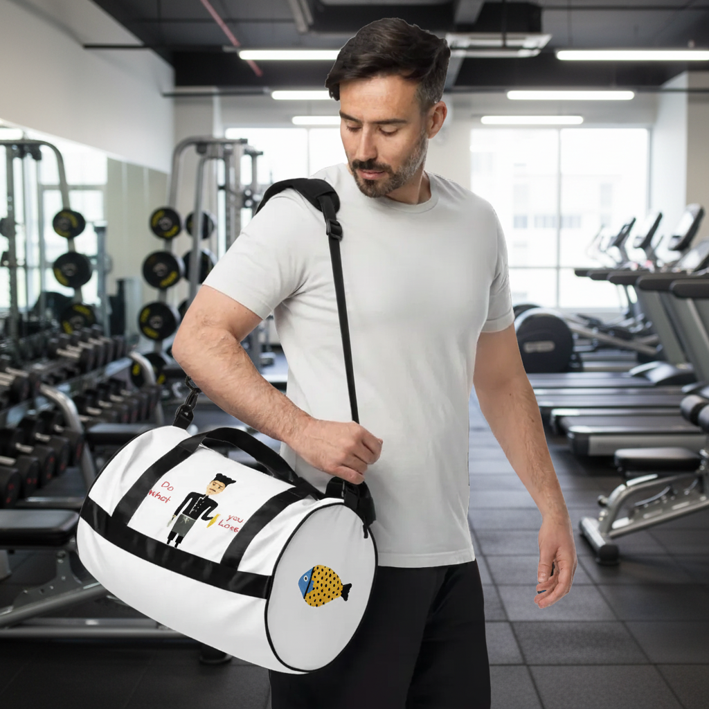 Man holding a white duffel bag with black accents and graphics on a white background