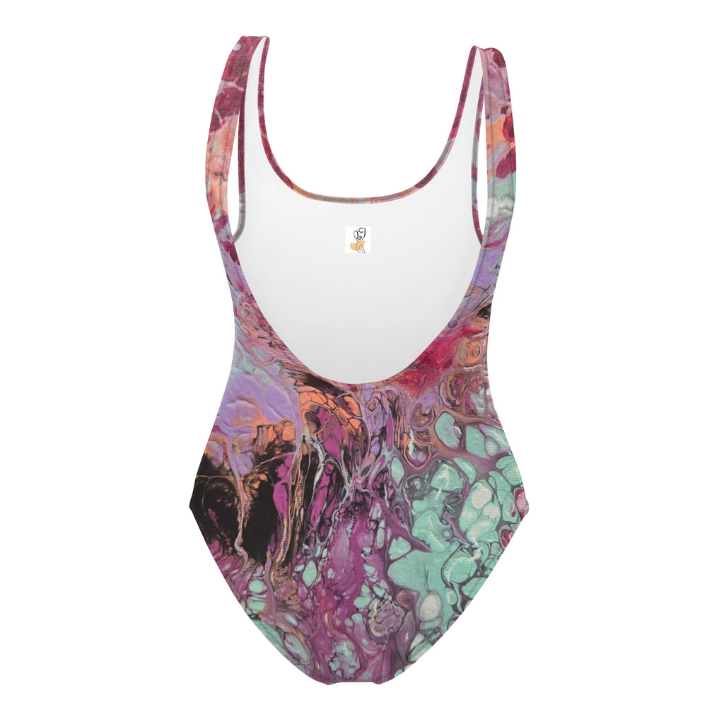 Colorful one-piece swimsuit with abstract pattern on a white background