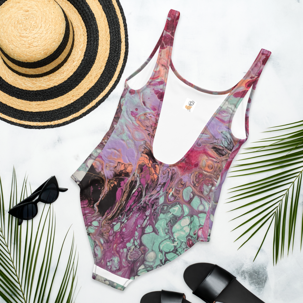 Colorful swimsuit with a sun hat, sunglasses, and sandals on a white background