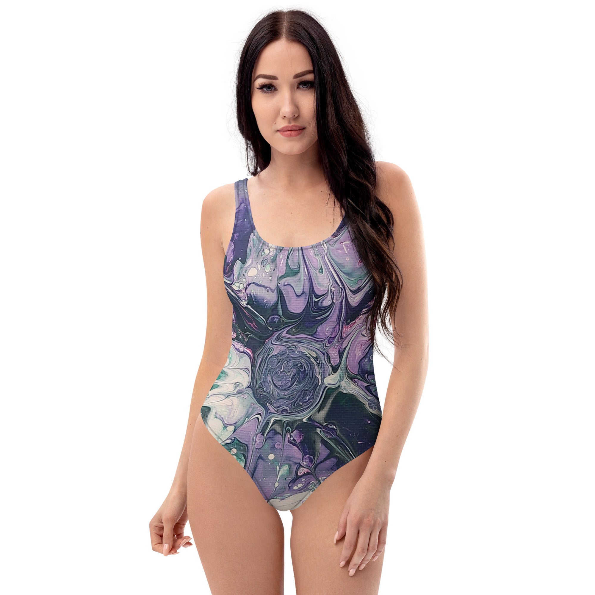 Woman wearing a one-piece swimsuit with a floral pattern on a white background