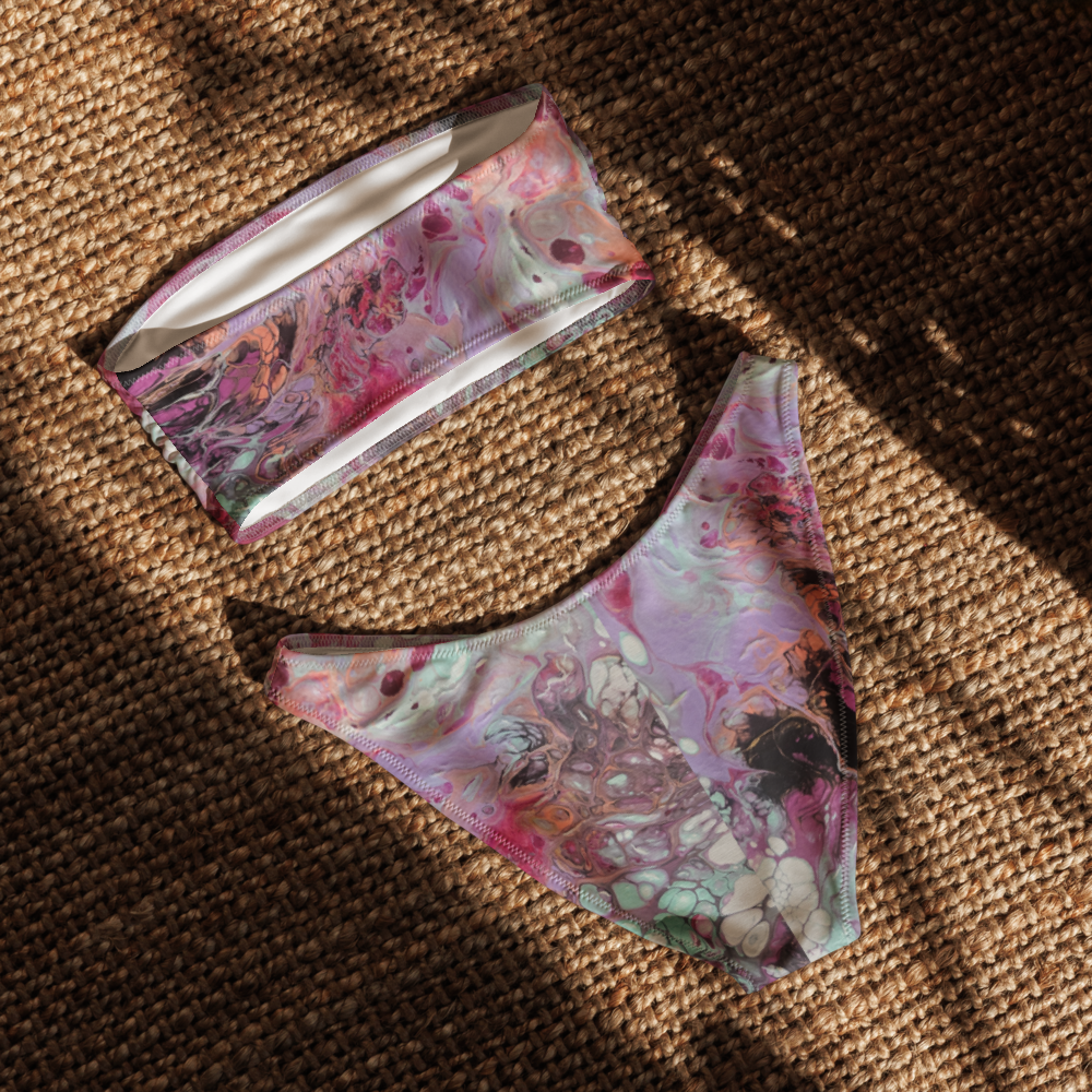Floral-patterned pouch and face mask on a textured brown surface