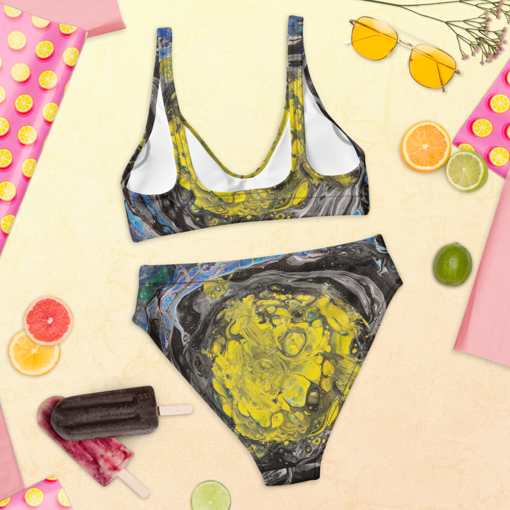 Marbled swimsuit with sunglasses, popsicles, and fruit on a yellow background