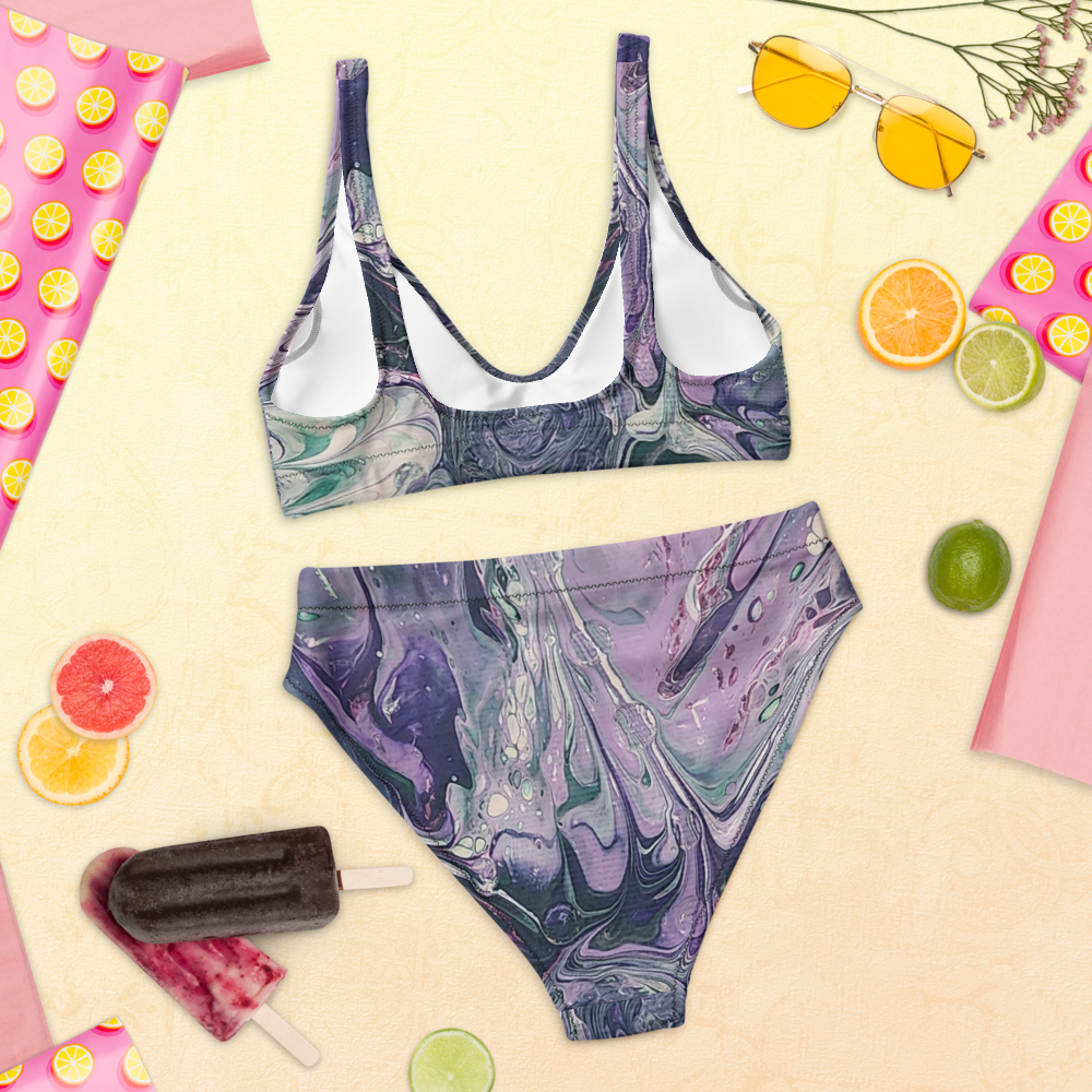 Marble-patterned bikini set with sunglasses, fruit slices, and a popsicle on a yellow background