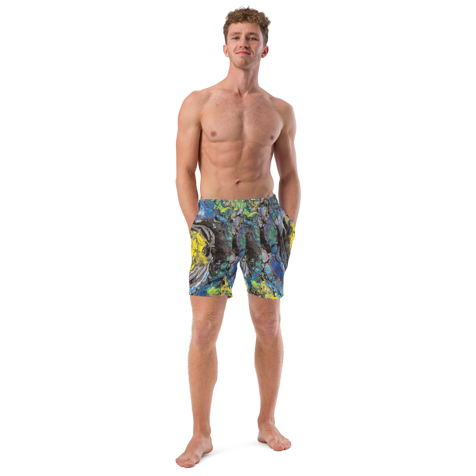 Man wearing colorful swim shorts on a white background