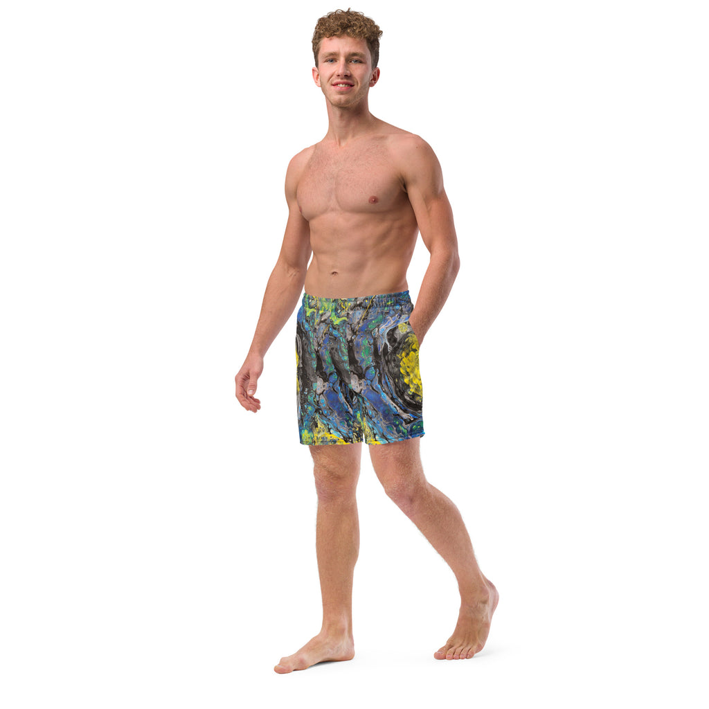 Man wearing colorful swim shorts on a white background