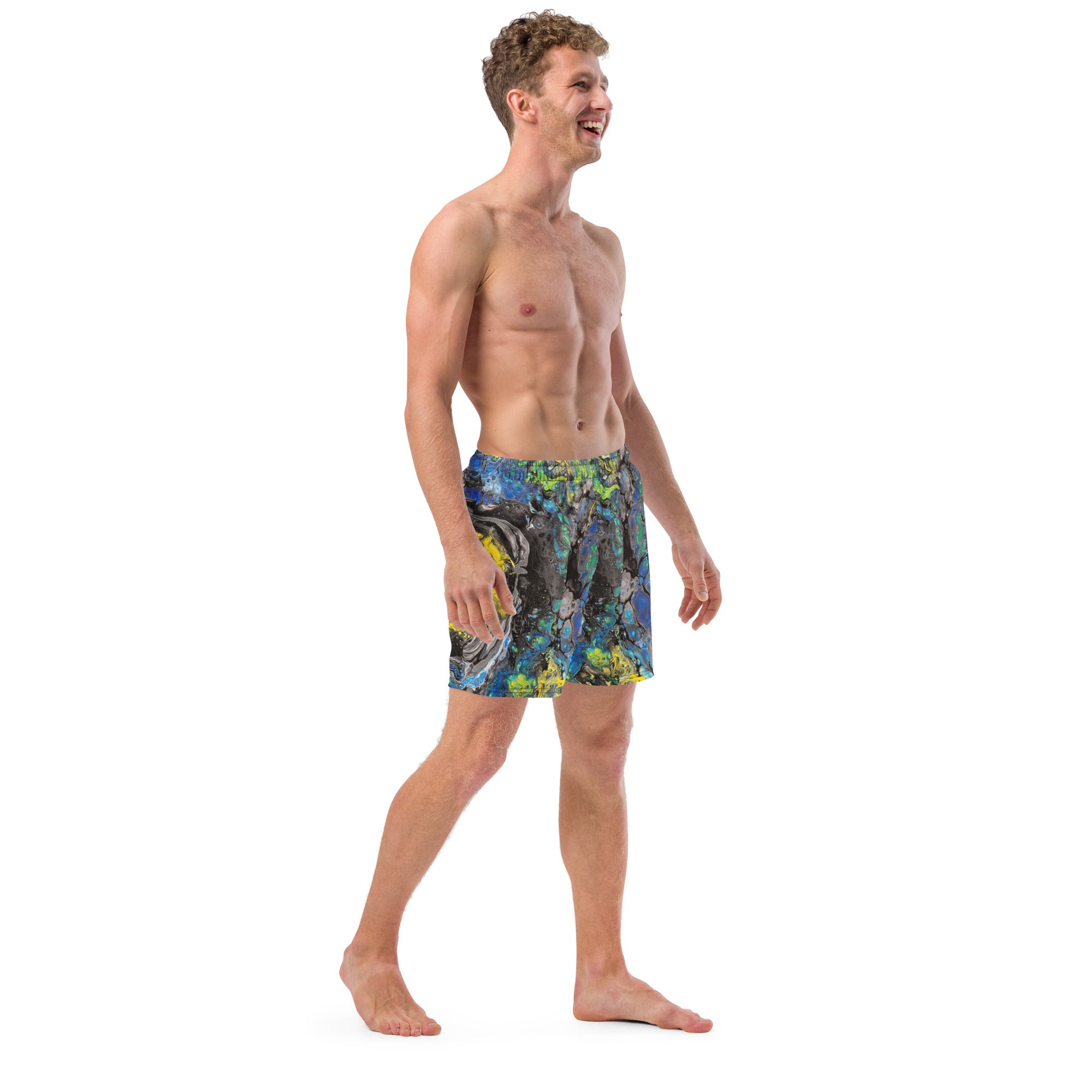 Man wearing colorful swim shorts on a white background