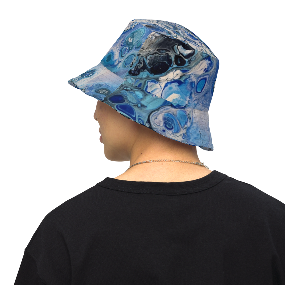Person wearing a blue patterned cap on a white background