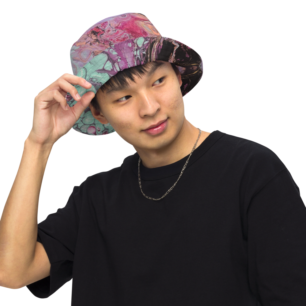 Person wearing a colorful bucket hat on a white background
