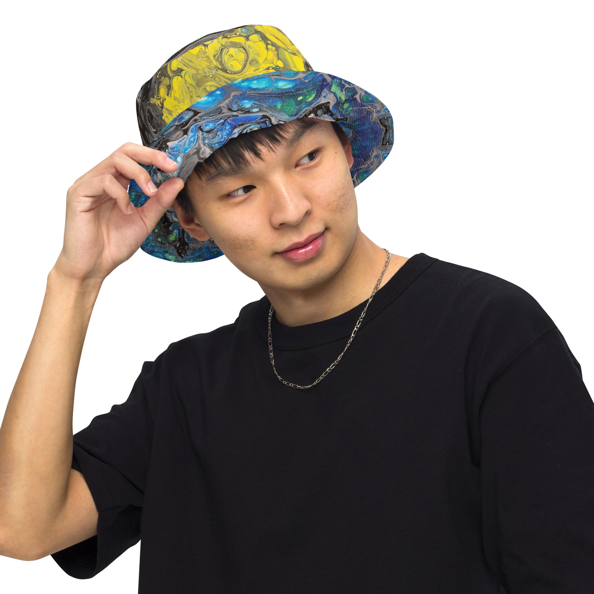 man wearing a colorful bucket hat on a white background
