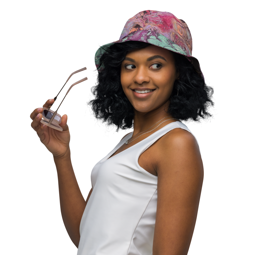 Woman wearing a colorful cap and holding sunglasses, on a white background