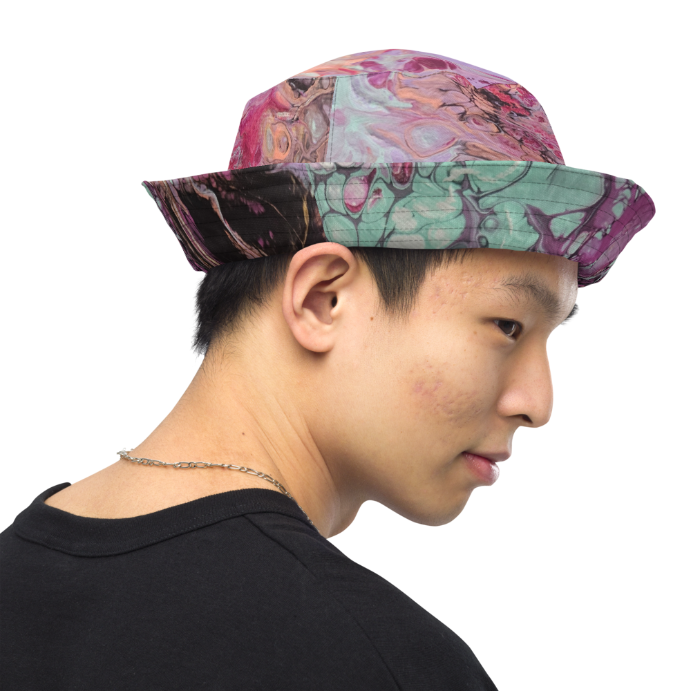 Person wearing a colorful patterned bucket hat on a white background