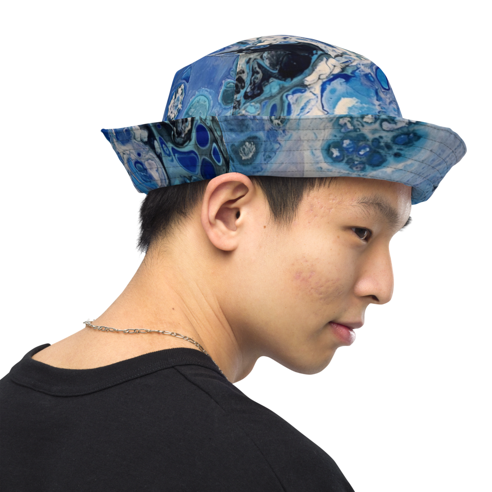 Person wearing a blue patterned bucket hat on a transparent background