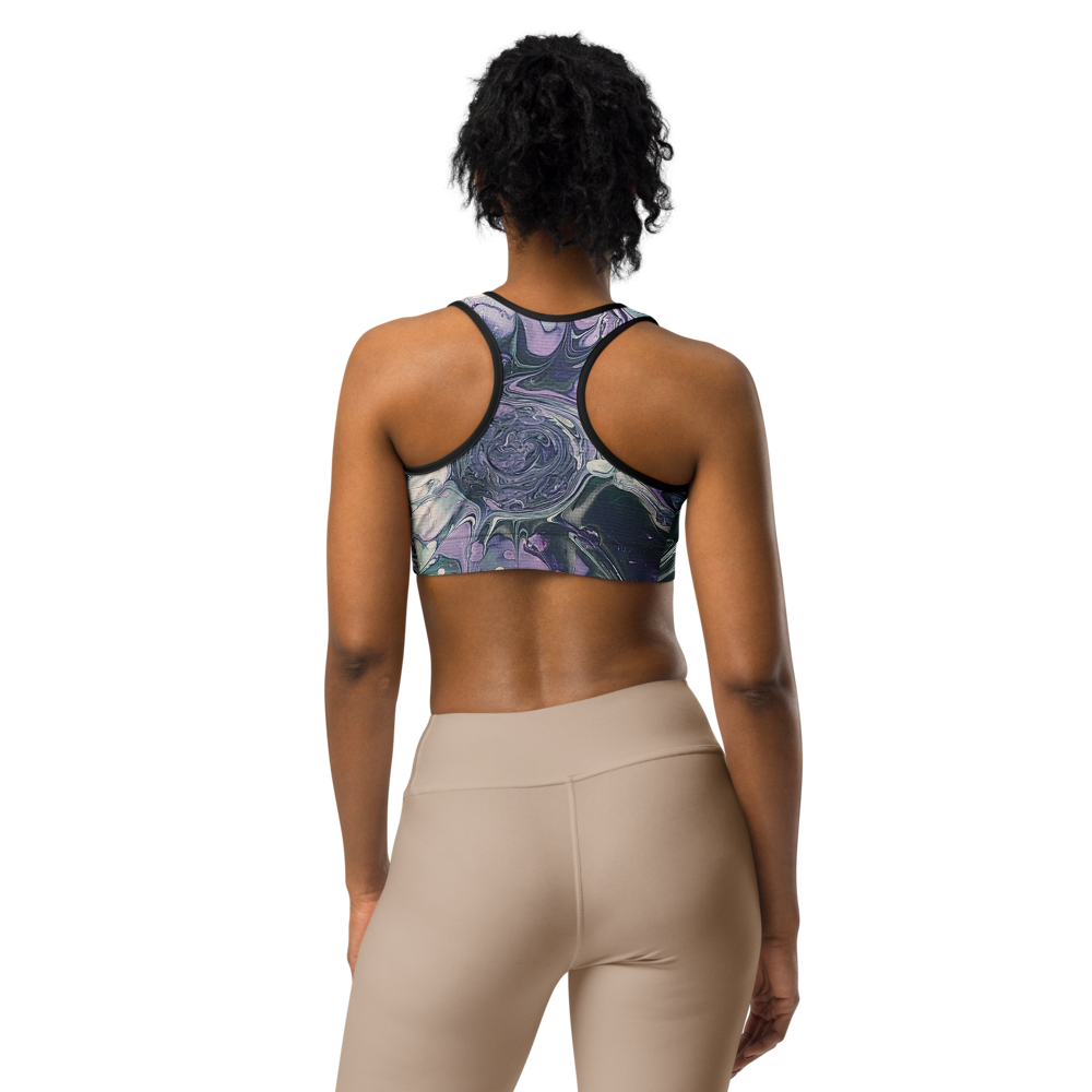 Person wearing a patterned sports bra and beige leggings on a white background