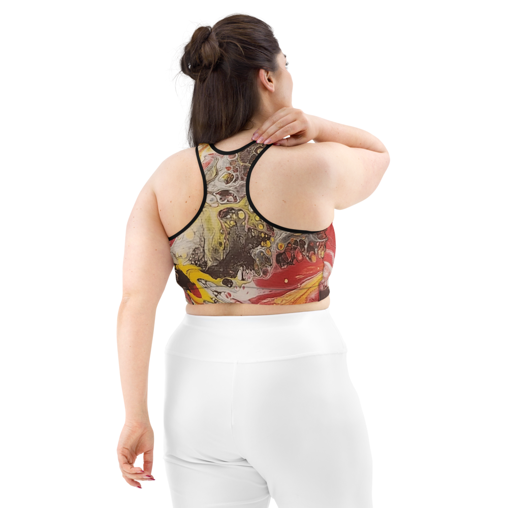 Woman wearing a colorful sports bra and white leggings on a white background