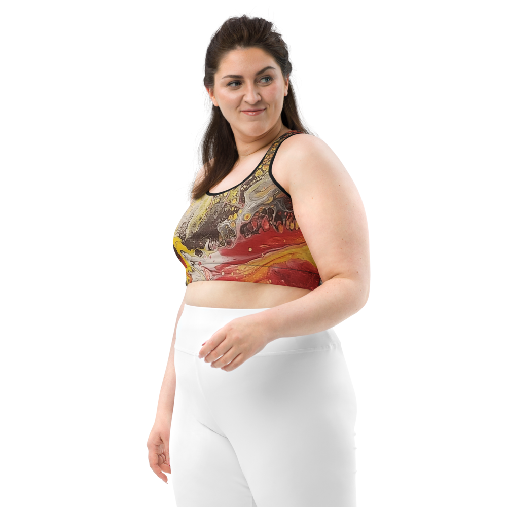 Woman wearing a colorful patterned top and white pants on a white background