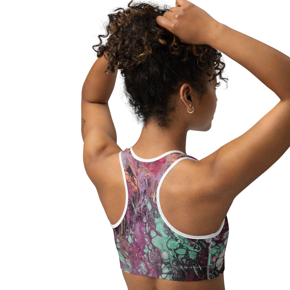 Person wearing a colorful sports bra with a white background