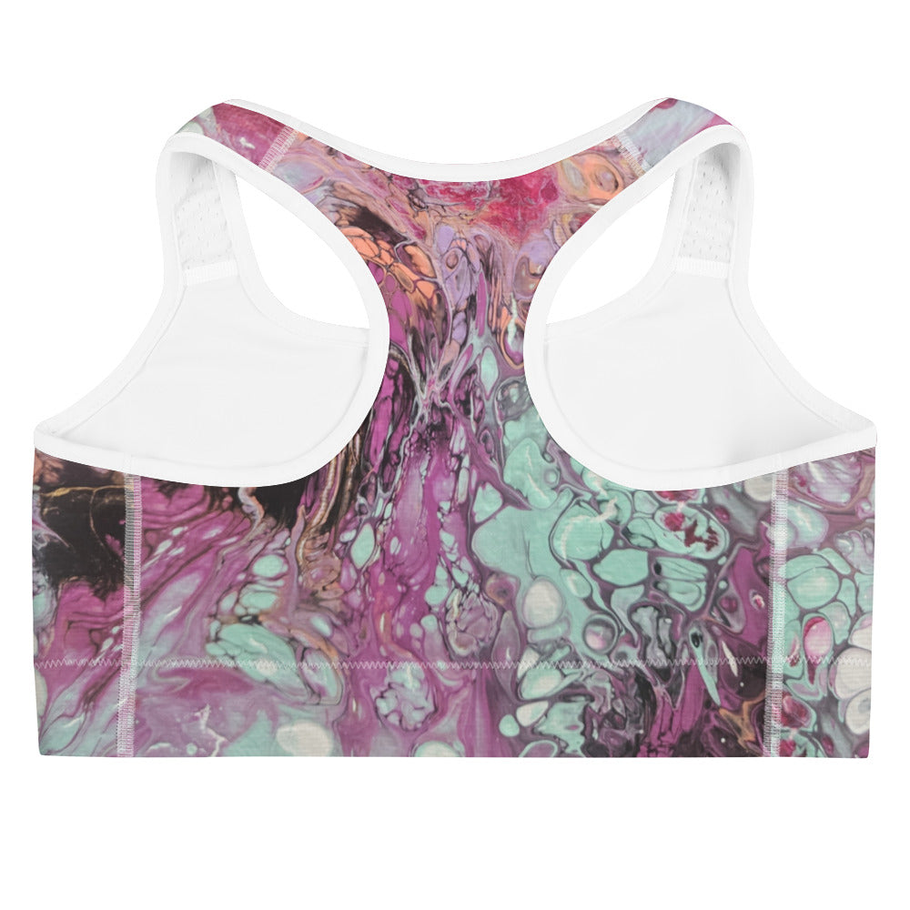 Multicolored abstract patterned top with white trim on a white background