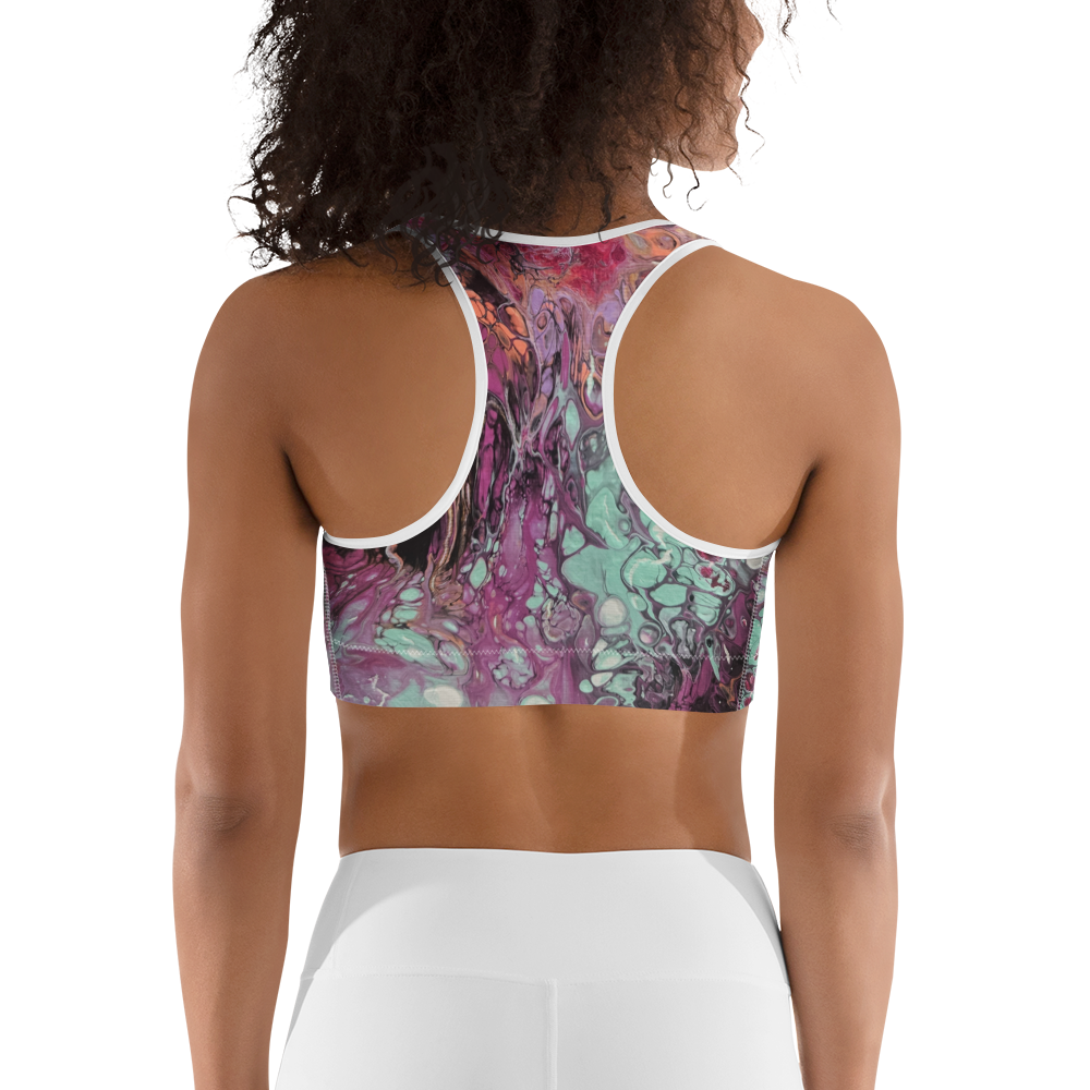 Person wearing a colorful sports bra and white leggings on a white background