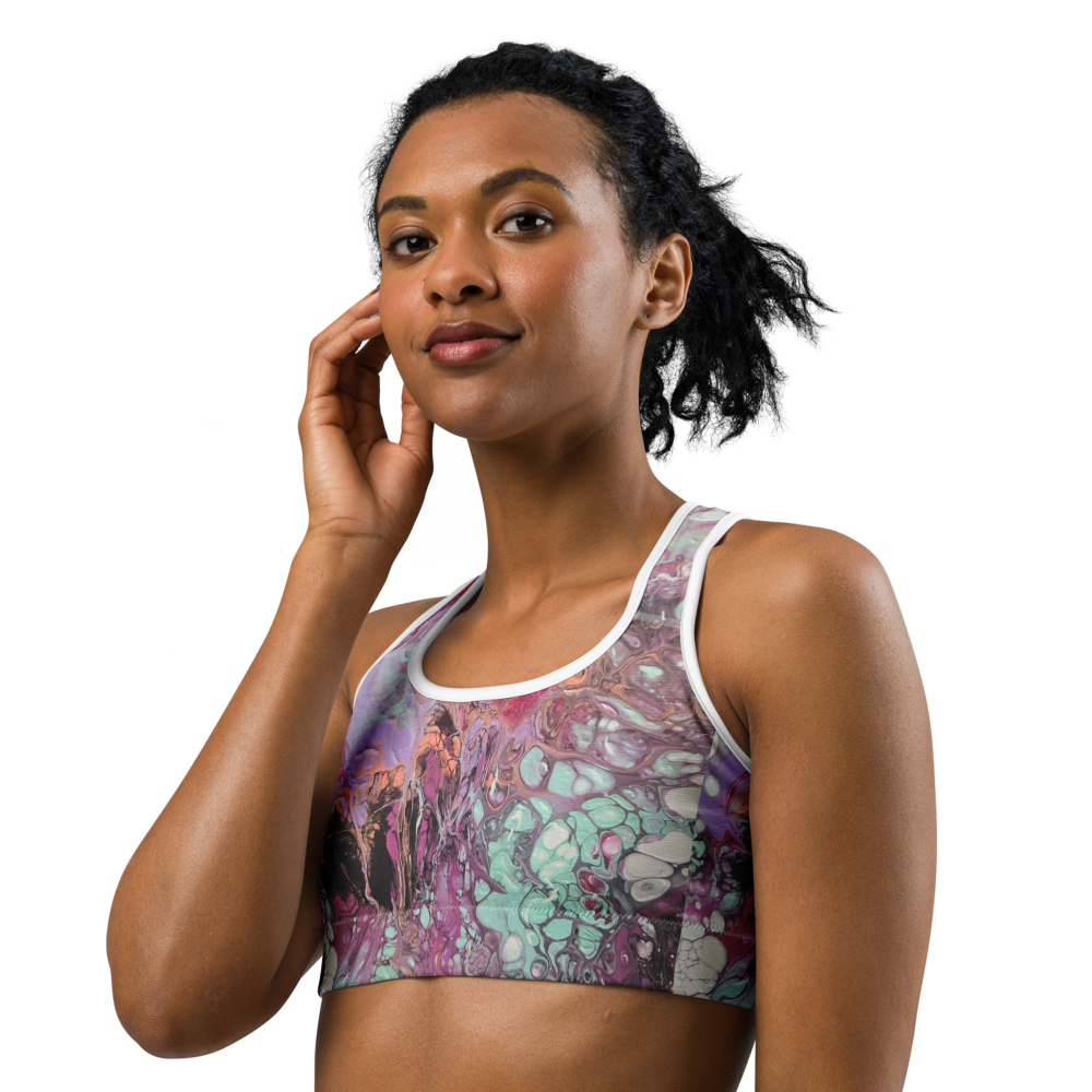 Woman wearing a colorful sports bra on a white background