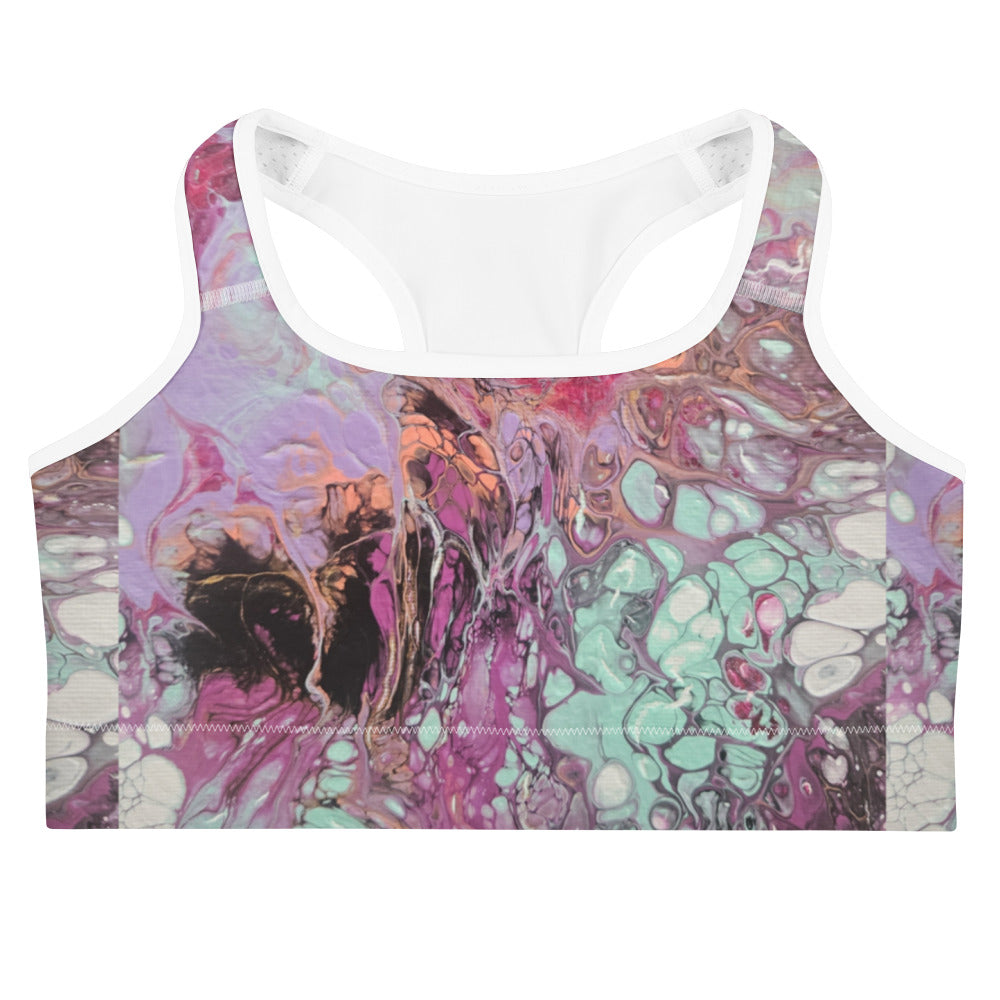 Colorful abstract patterned sports bra on a white background