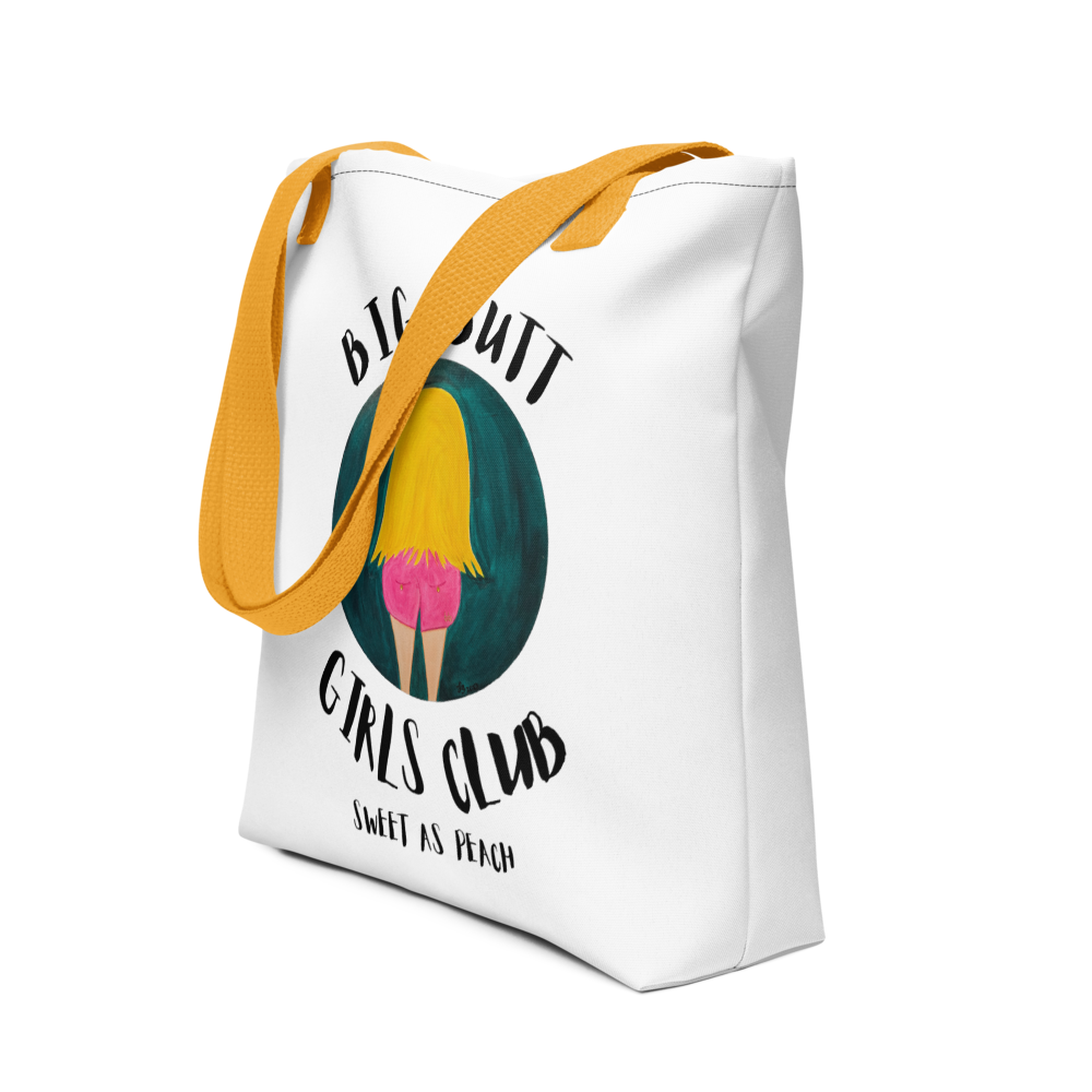 White tote bag with yellow strap featuring graphic design and text on a white background