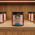 a candle sitting on a store shelf