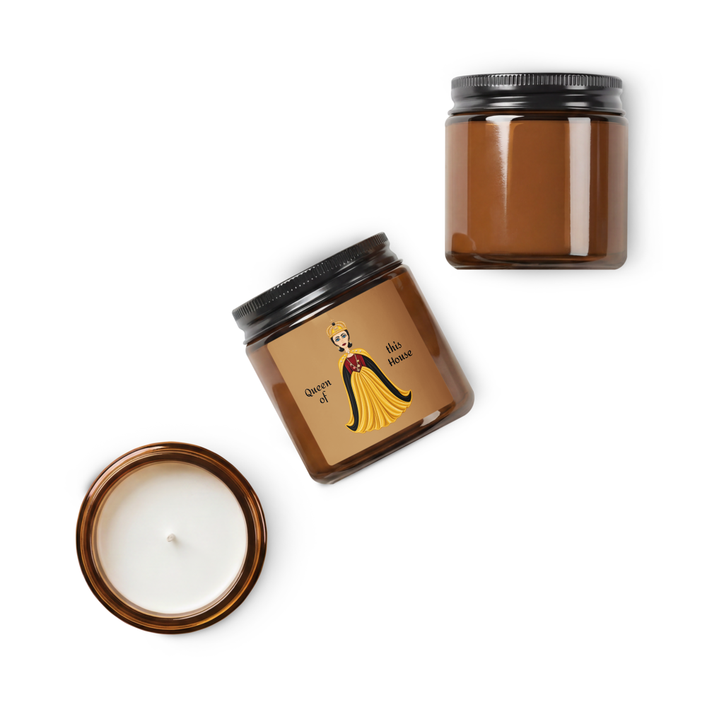 Three amber glass jar candles on a white background: one open jar with its lid placed beside it, and one closed jar with a black lid. The center jar has a brown label with an illustrated figure and the text 'Queen of Hot Hair'.