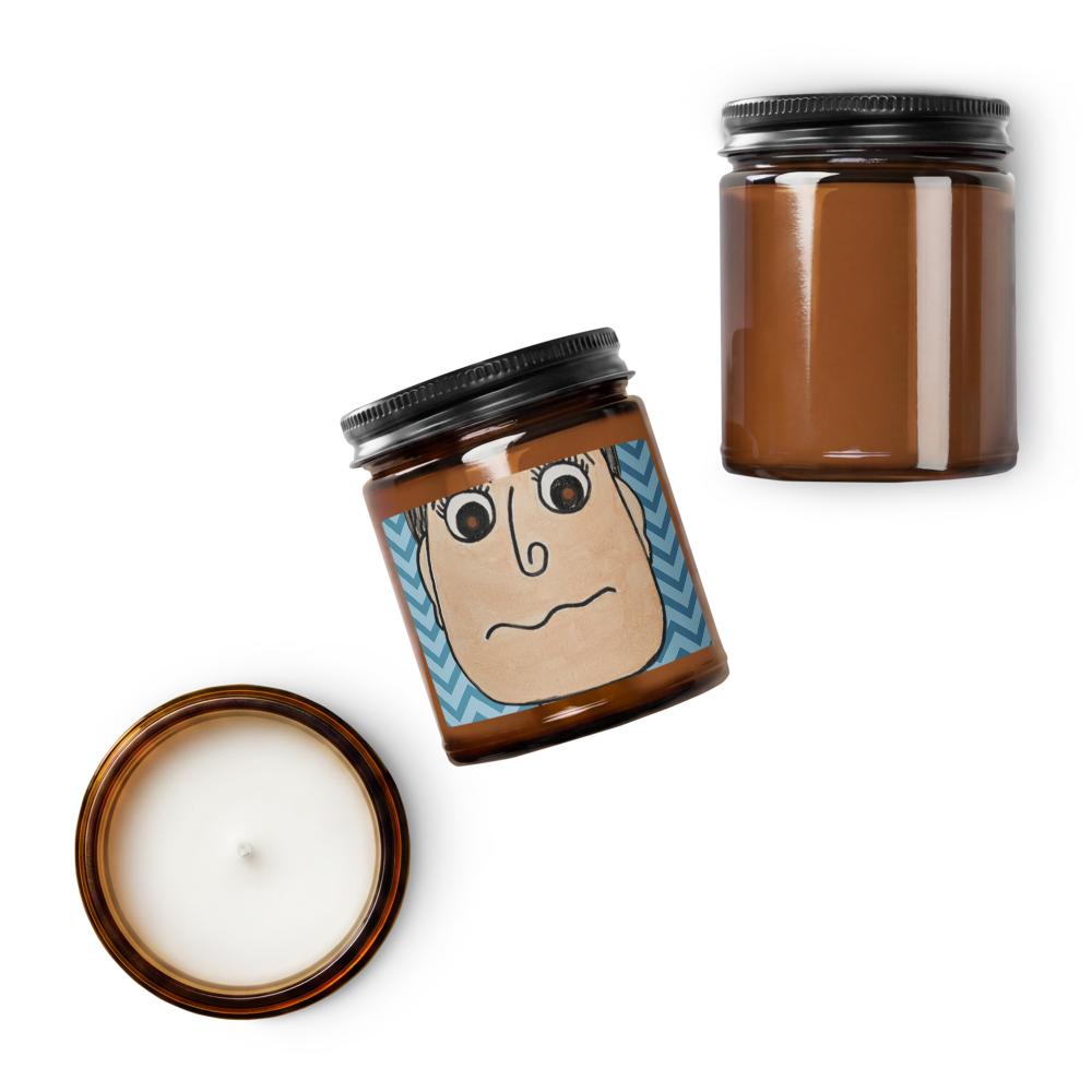 Candle with a face design on the lid and another candle in a jar on a white background