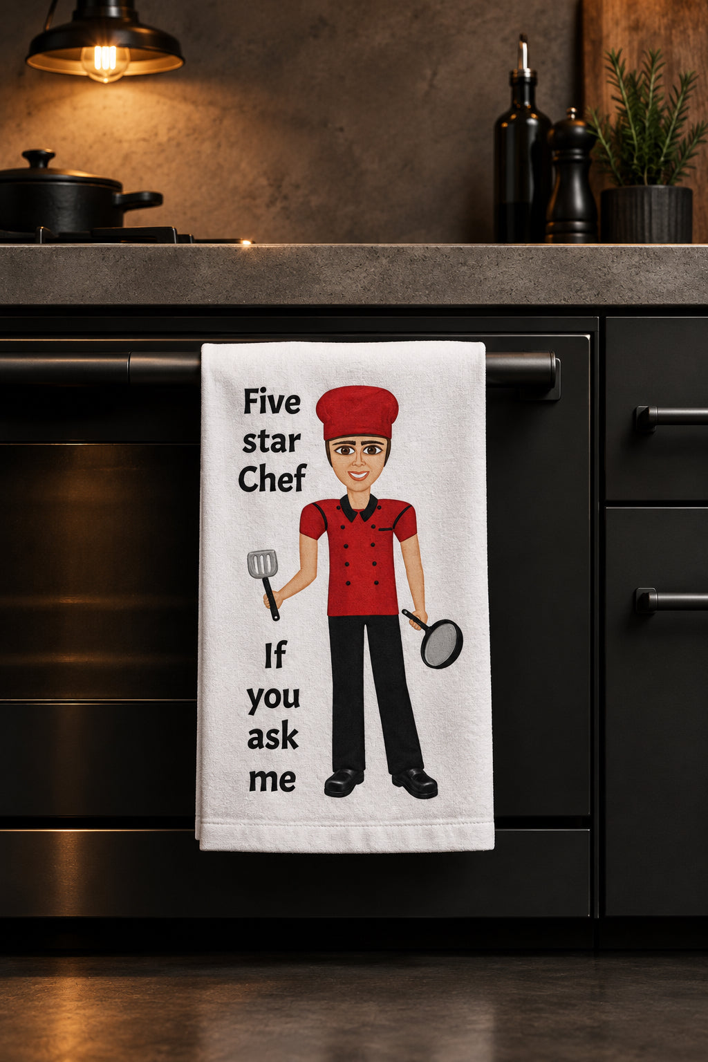 Picture of a kitchen hand towel hanging ion a stove handle