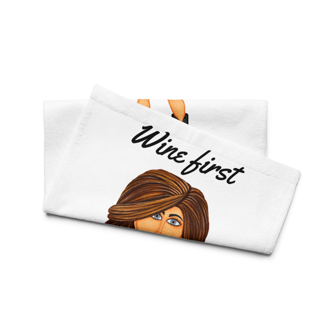 side view of a kitchen hand towel with a whimsical character holding a glass of wine on a white background
