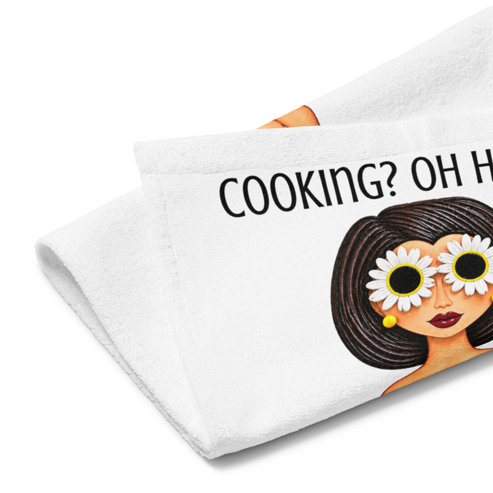 side view of a kitchen hand towel with a whimsical character dressed in daisys on a white background