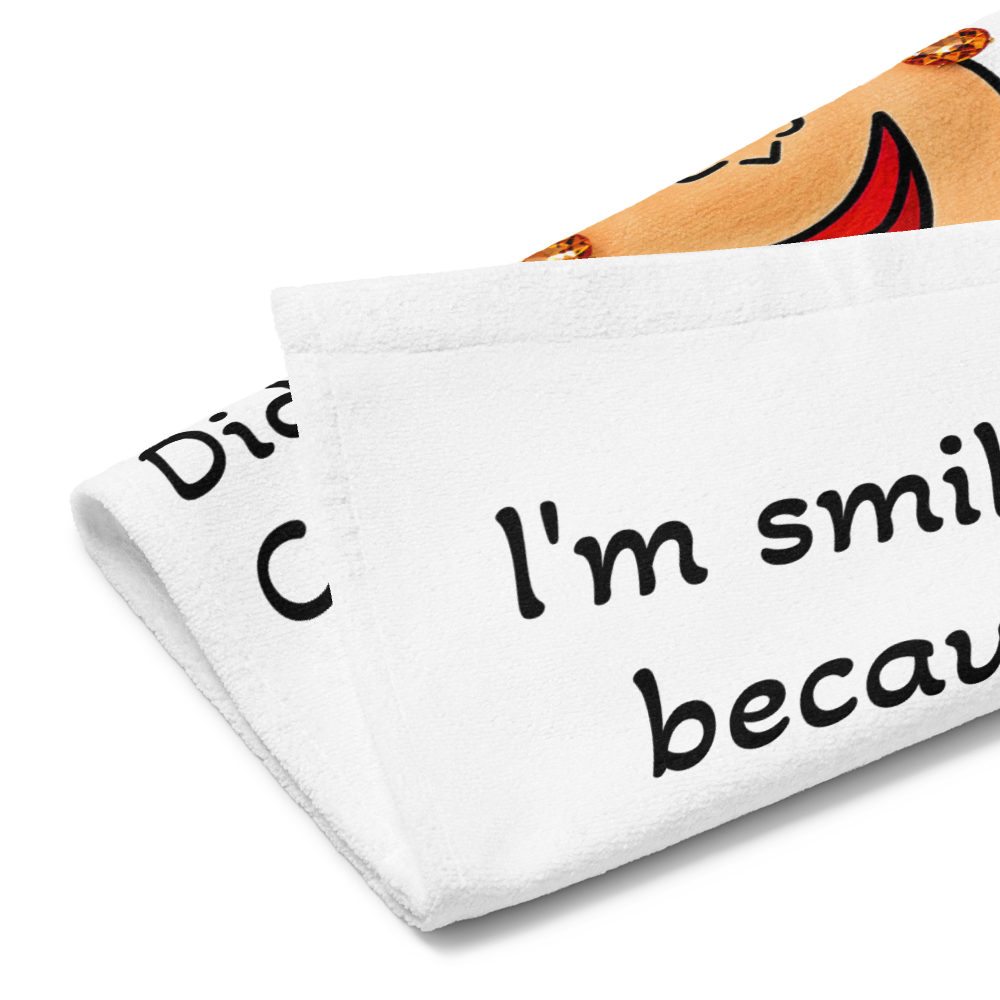 side view of a whimsical character kitchen hand towel on a white background