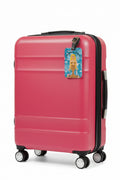 picture of a pink suitcase with a mermaid luggage tag