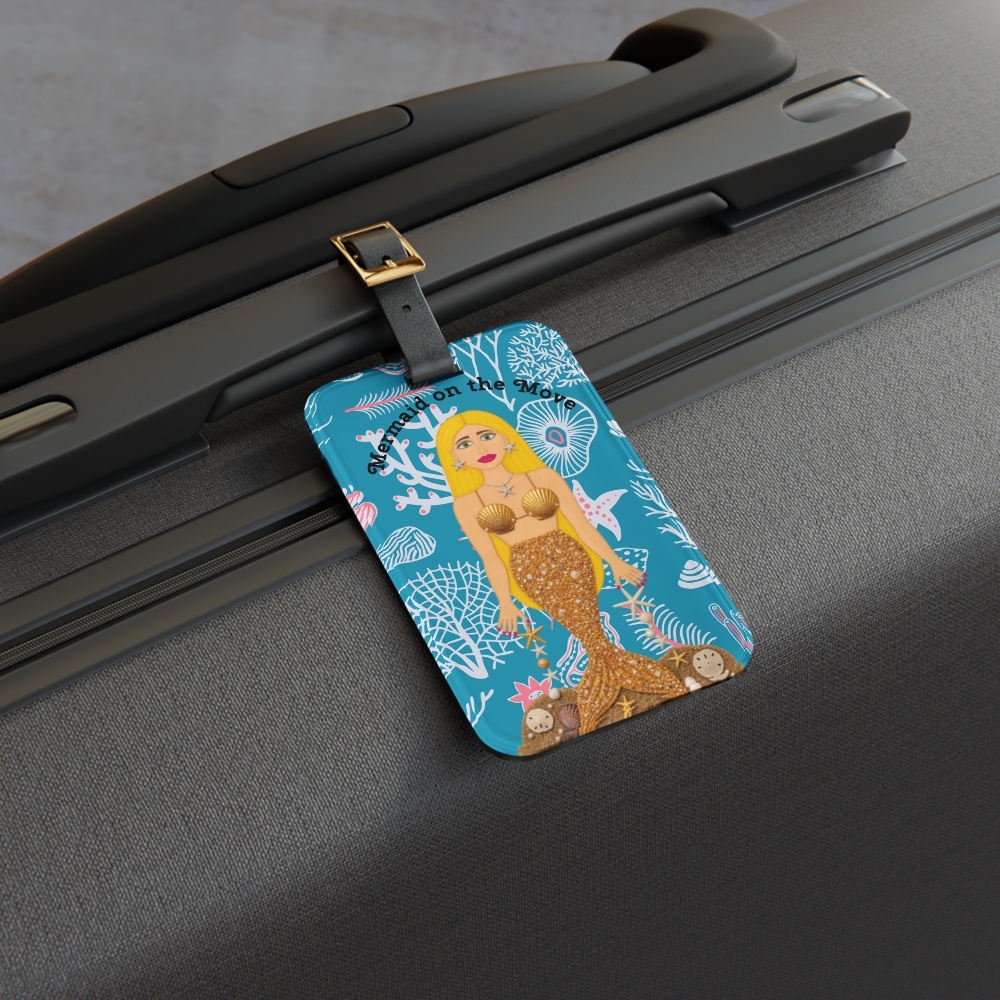 picture of a mermaid luggage tag on a black suitcase