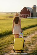 A rectangular luggage tag with rounded corners, featuring a colorful illustrated portrait of a blonde woman with blue eyes and pink clothing, plus the text 'Southern Sass on the Go.' The tag has a black strap with a gold-tone buckle and is shown on a plain white background.