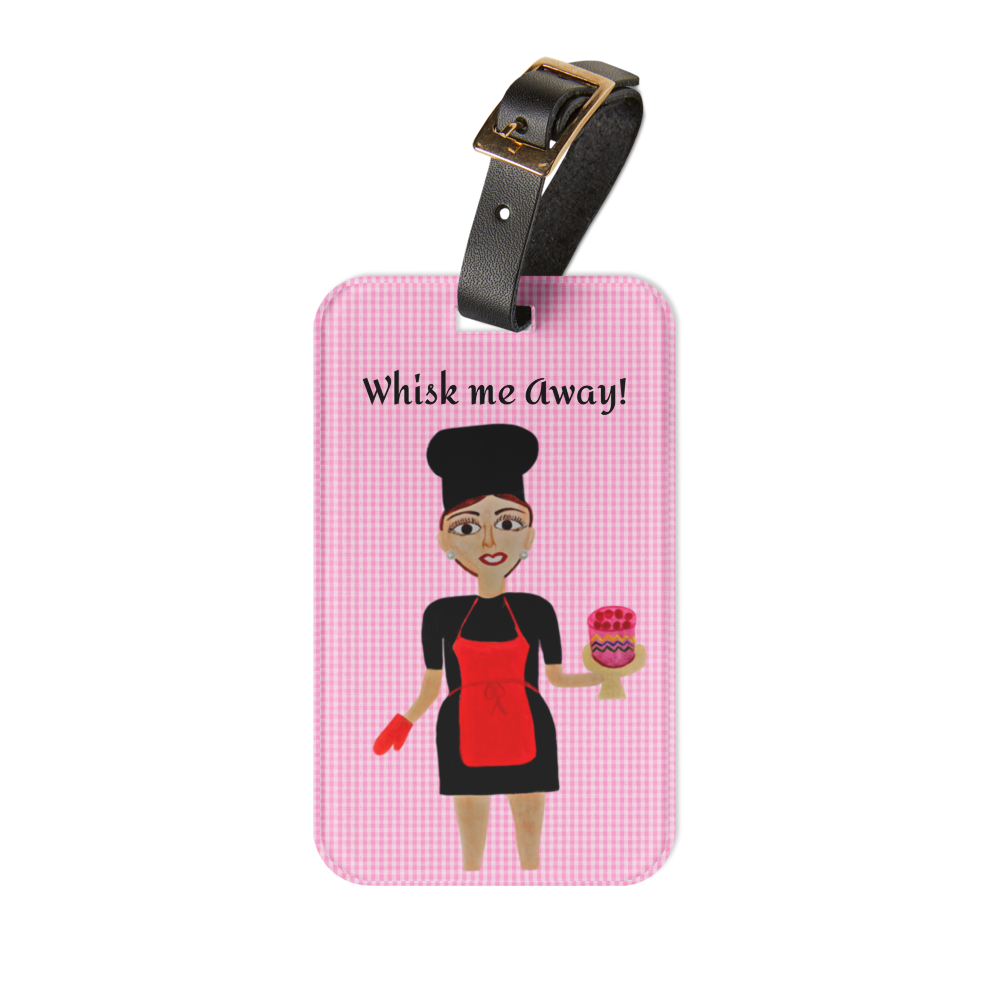 A rectangular luggage tag with a pink gingham pattern, featuring a cartoon illustration of a female chef holding a pink cake and the text 'Whisk me Away!'. The tag has a black strap with a gold-tone buckle.