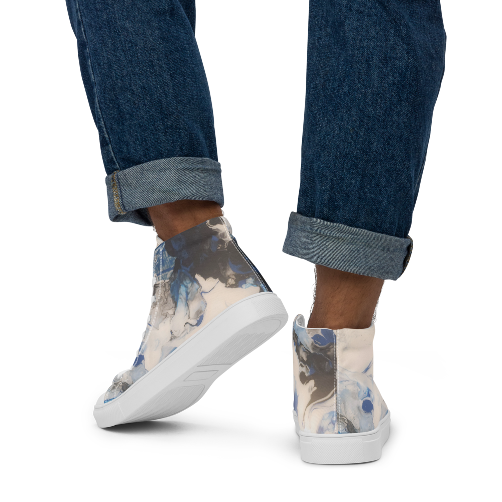 High-top sneakers with floral pattern worn with rolled-up jeans on a white background