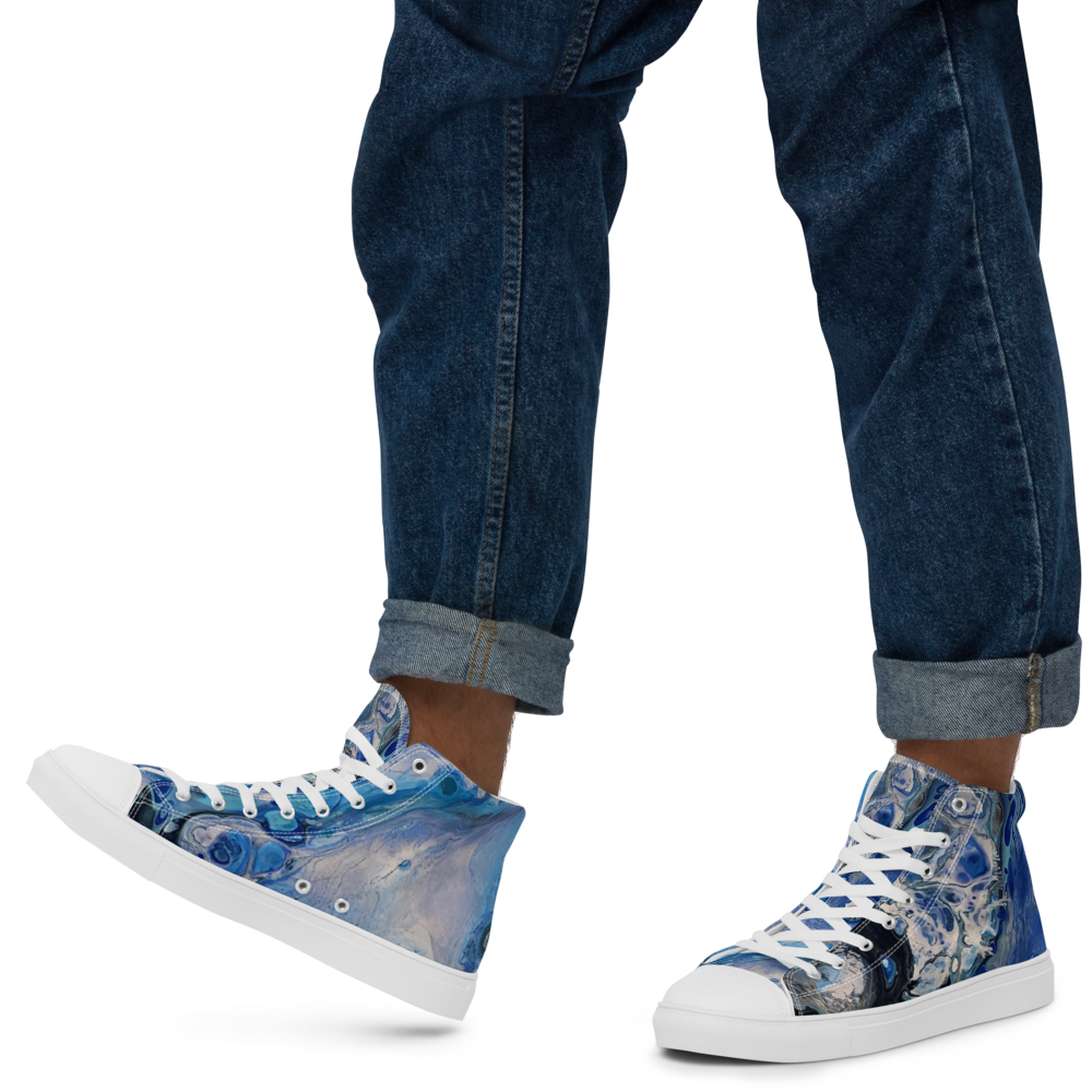 Blue denim high-top sneakers worn with rolled-up jeans on a white background