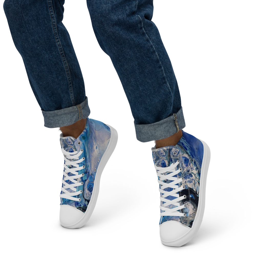 Blue floral high-top sneakers worn with rolled-up jeans on a white background