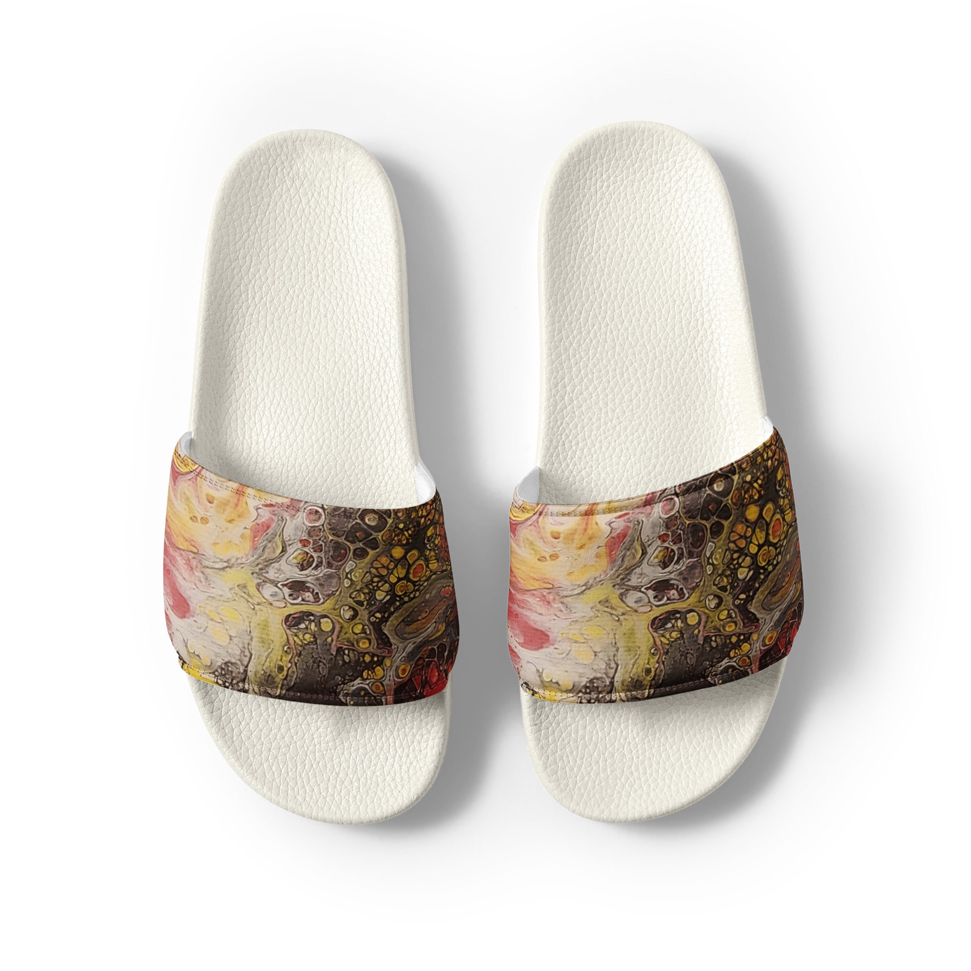 Pair of slides with abstract patterned straps on a white background