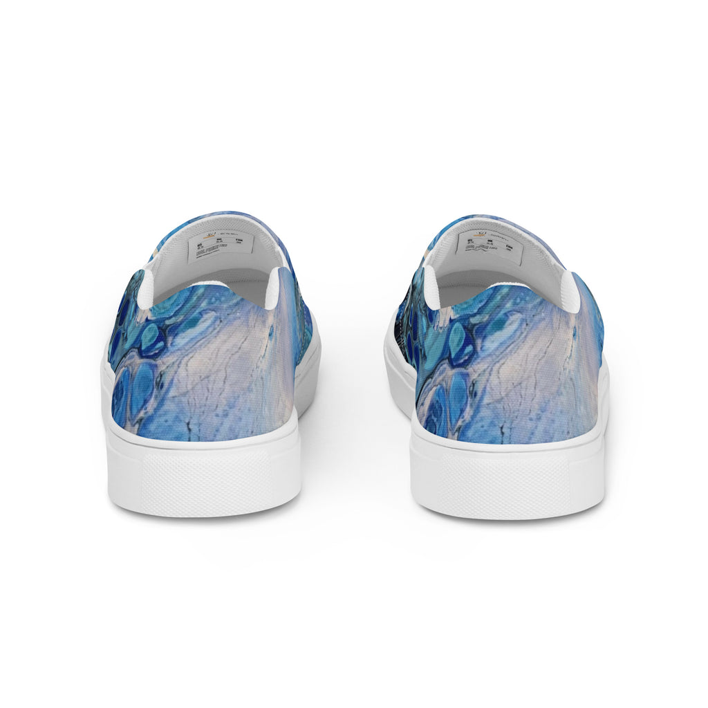 Blue marbled slip-on shoes on a white background